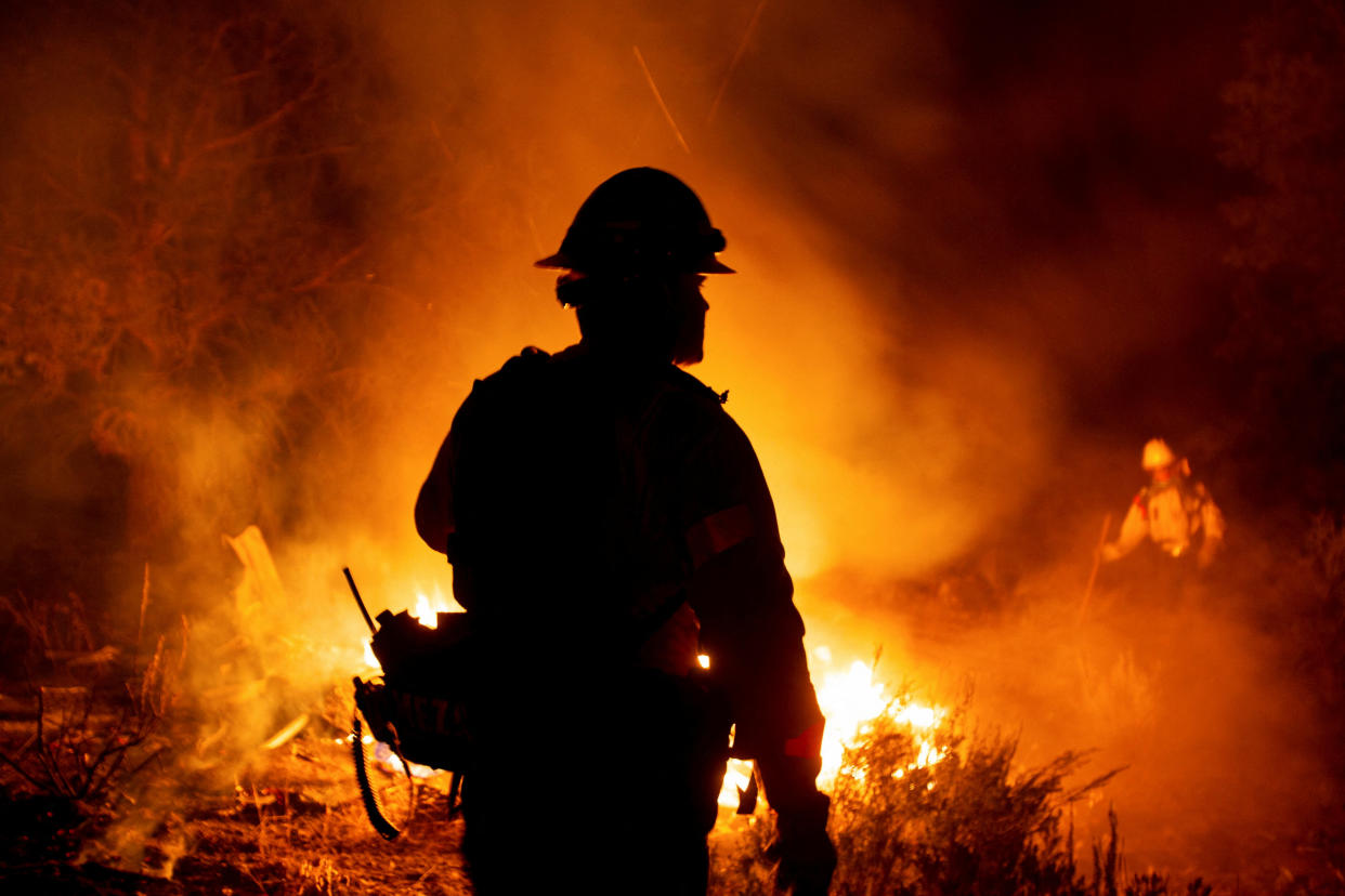 Firefighters battle the Bridge Fire in Wrightwood, Calif., on Wednesday.