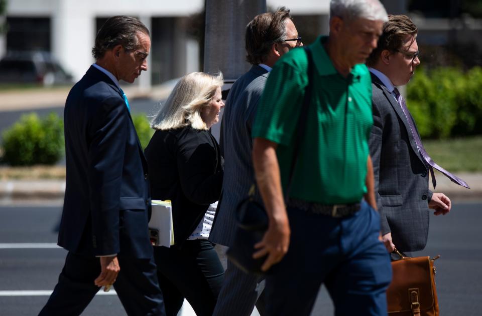 Tricia Derges leaves the Federal Courthouse with her attorneys after being found guilty of 22 counts, including wire fraud, illegal distribution of controlled substances and making false statements to investigators.