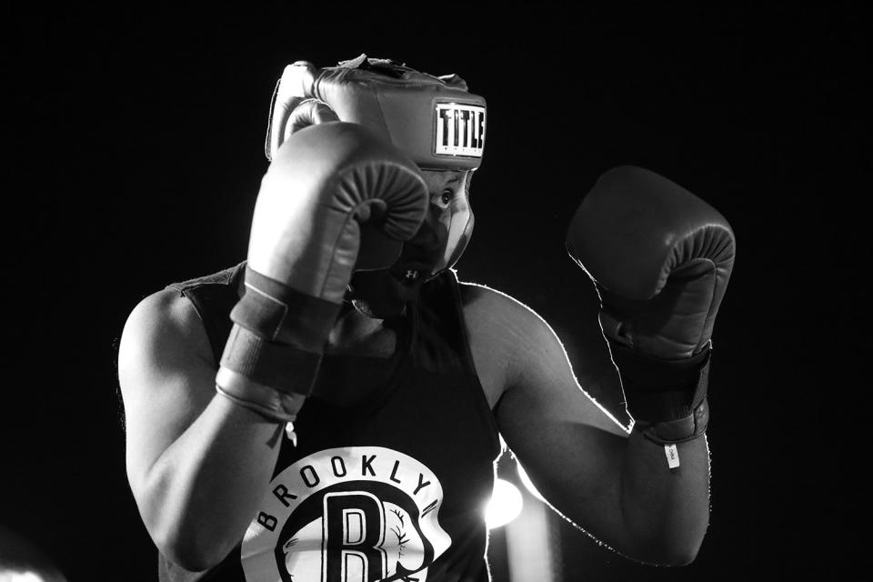 <p>Mcgregor Phillipe puts up his gloves to protect himself from opponent Giro Maccheroni, both from the 13th Precinct in Manhattan, during the Brooklyn Smoker in Coney Island, Brooklyn, on Aug. 24, 2017. (Photo: Gordon Donovan/Yahoo News) </p>