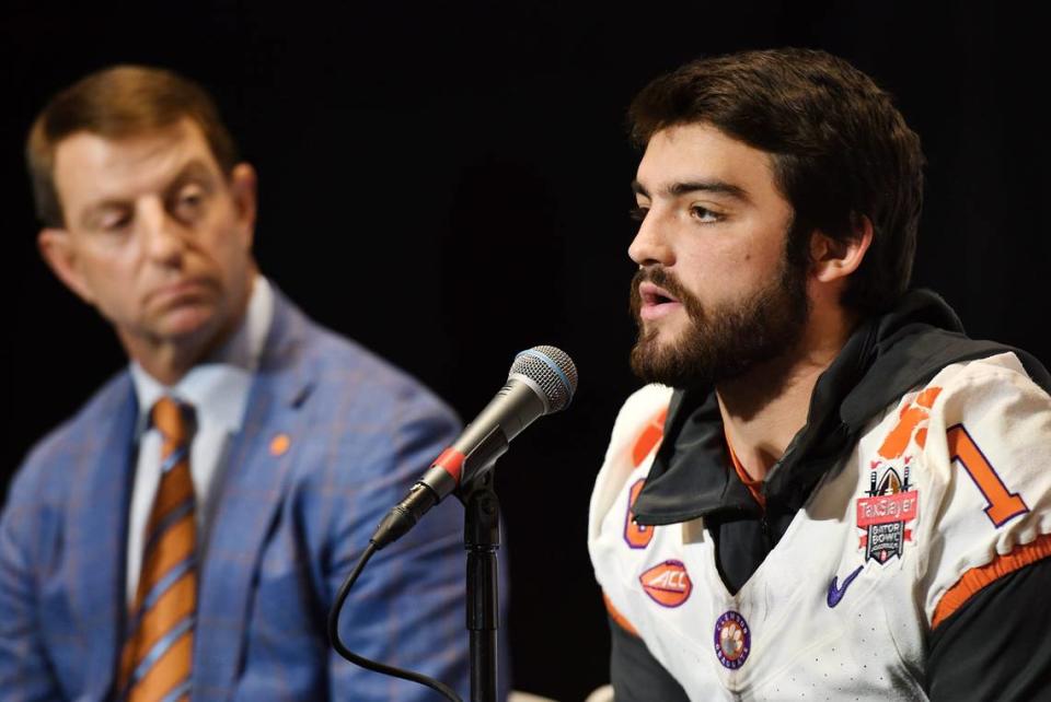 Clemson Running Back Will Shipley fields questions from the media as Head Coach Dabo Swinney looks on during Thursday’s press conference. The Gator Bowl press conferences with Kentucky Head Coach Mark Stoops and Clemson Head Coach Dabo Swinney was held Thursday, December 28, 2023, in the east club at EverBank Stadium the day before the the historic college football bowl game in Jacksonville, Florida.