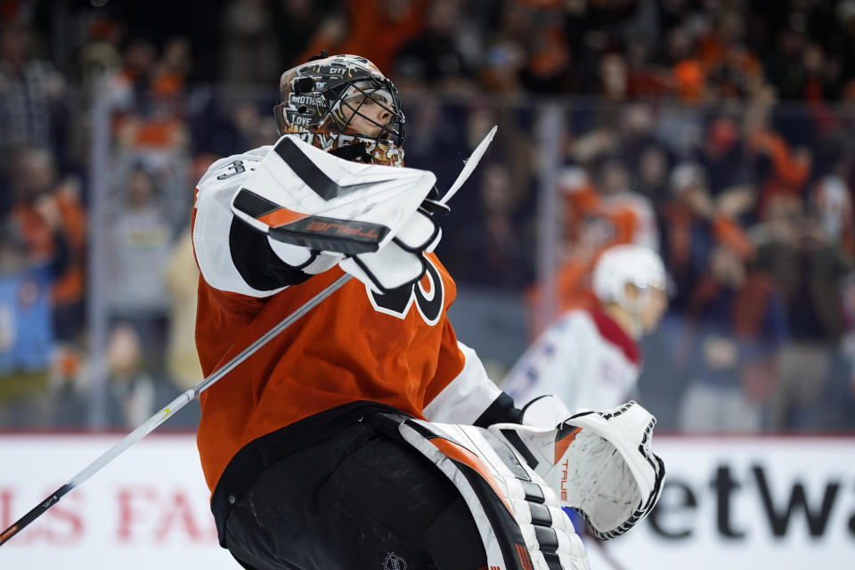 Philadelphia Flyers' Samuel Ersson, left, reacts after blocking a shot by Montreal Canadiens' Jesse Ylonen during a shootout in an NHL hockey game, Wednesday, Jan. 10, 2024, in Philadelphia. (AP Photo/Matt Slocum)