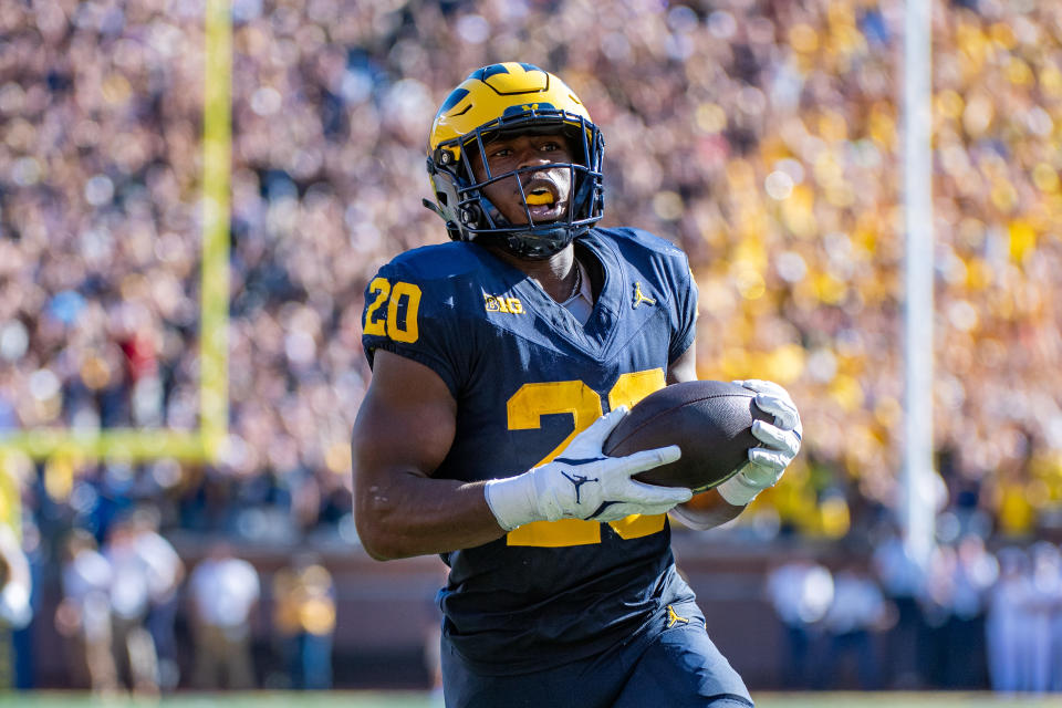 ANN ARBOR, MICHIGAN – SEPTEMBER 21: Kalel Mullings #20 of the Michigan Wolverines runs with the ball away from defenders and scores a touchdown during the first half of a college football game against the USC Trojans at Michigan Stadium on September 21, 2024 in Ann Arbor, Michigan. (Photo by Aaron J. Thornton/Getty Images)