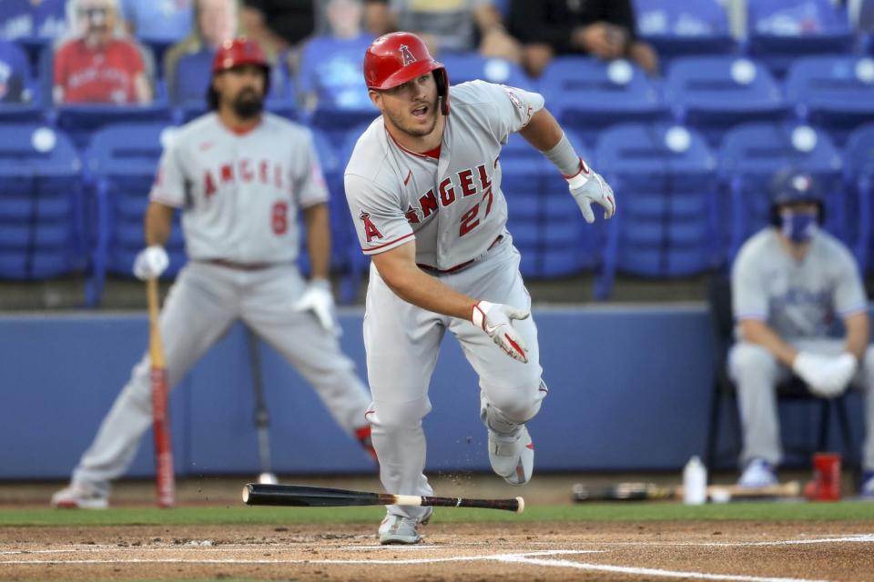 Mike Trout drops the bat and takes off running for first base after getting a hit