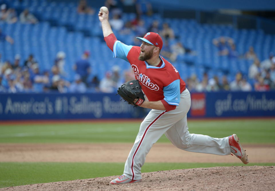 Philadelphia Phillies' relief pitcher Tommy Hunter throws against the Toronto Blue Jays during the eighth inning of a baseball game Sunday, Aug. 26, 2018, in Toronto. (Jon Blacker/The Canadian Press via AP)