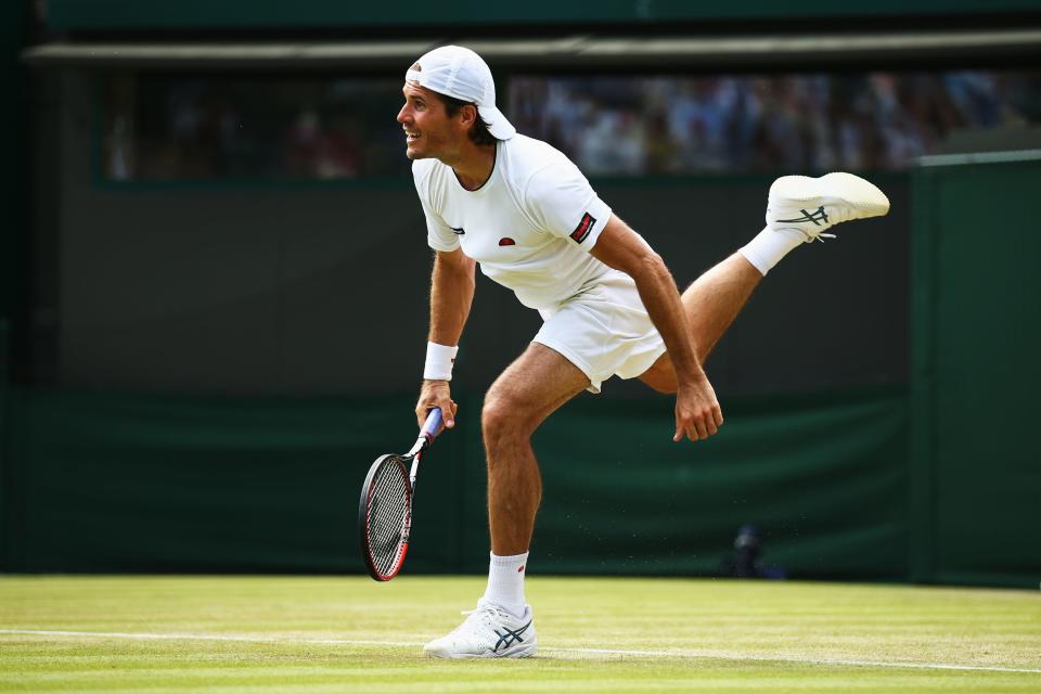 Tommy Haas serves to Milos Raonic at the Wimbledon Lawn Tennis Championships at the All England Lawn Tennis and Croquet Club on July 1, 2015 in London.