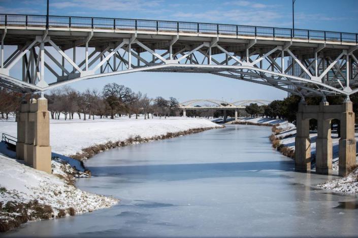 The Trinity River is mostly frozen after a snow storm Monday, Feb. 15, 2021, in Fort Worth.