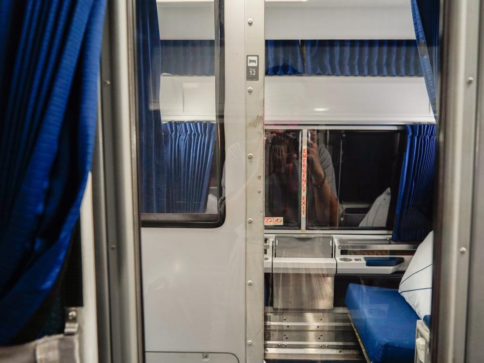 A view of an empty roomette across from the author's on an Amtrak.