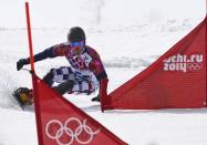 Russia's Vic Wild competes during the men's parallel snowboard finals at the 2014 Sochi Winter Olympic Games in Rosa Khutor February 22, 2014. REUTERS/Dylan Martinez (RUSSIA - Tags: OLYMPICS SPORT SNOWBOARDING)