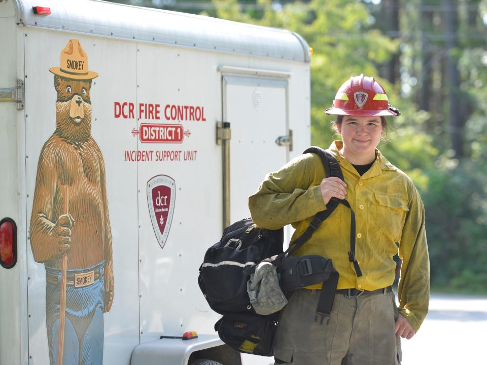 Nicole Madden is a firefighter who has returned from Canada where she was part of a crew fighting wildfires. She was photographed at Shawme-Crowell State Forest where she works for Massachusetts Department of Conservation & Recreation.