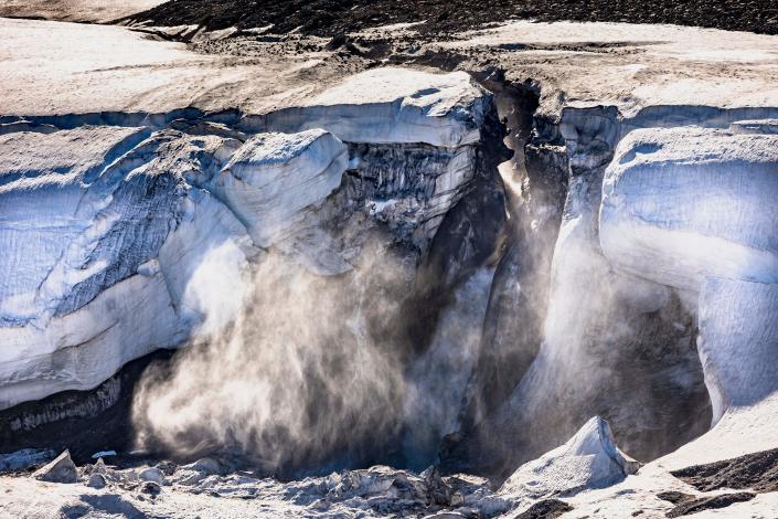 Meltwater flows from the Greenland ice sheet into the Baffin Bay near Pituffik, Greenland.