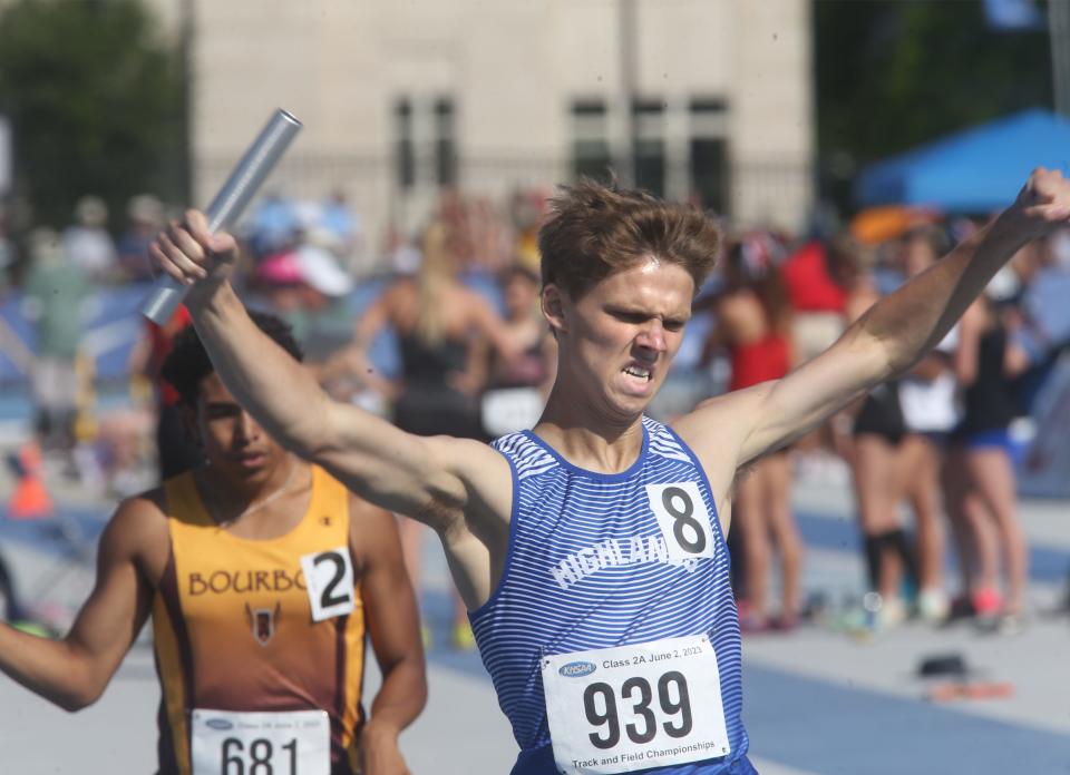 Caden Schroeder of Highlands raises his arms in victory as Highlands wins the 4x800 relay race at the KHSAA Class 2A state track meet Friday, June 2, in Lexington.