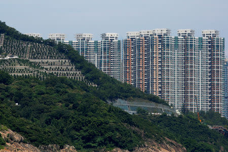 Private residential blocks are seen behind a cemetery at Tseung Kwan O district in Hong Kong, China September 15, 2018. REUTERS/Bobby Yip