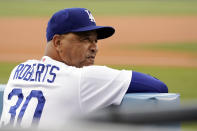 Los Angeles Dodgers manager Dave Roberts watches from the dugout before the team's baseball game against the San Francisco Giants on Thursday, July 22, 2021, in Los Angeles. (AP Photo/Marcio Jose Sanchez)