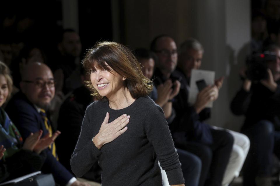 French designer Veronique Nichanian acknowledges applause at the end of Hermes Men's Fall Winter 2017-2018 fashion collection, presented in Paris, Saturday, Jan. 21, 2017. (AP Photo/Thibault Camus)