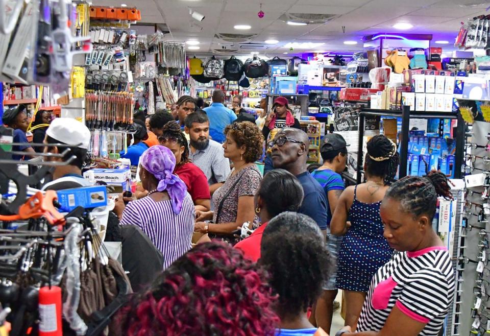 People shop for supplies in Bridgetown, Barbados on Sunday as Hurricane Beryl raced towards the eastern Caribbean.  Advanced notice is key for hurricanes because it can take people longer to internalize the impending threat, experts say (REUTERS)