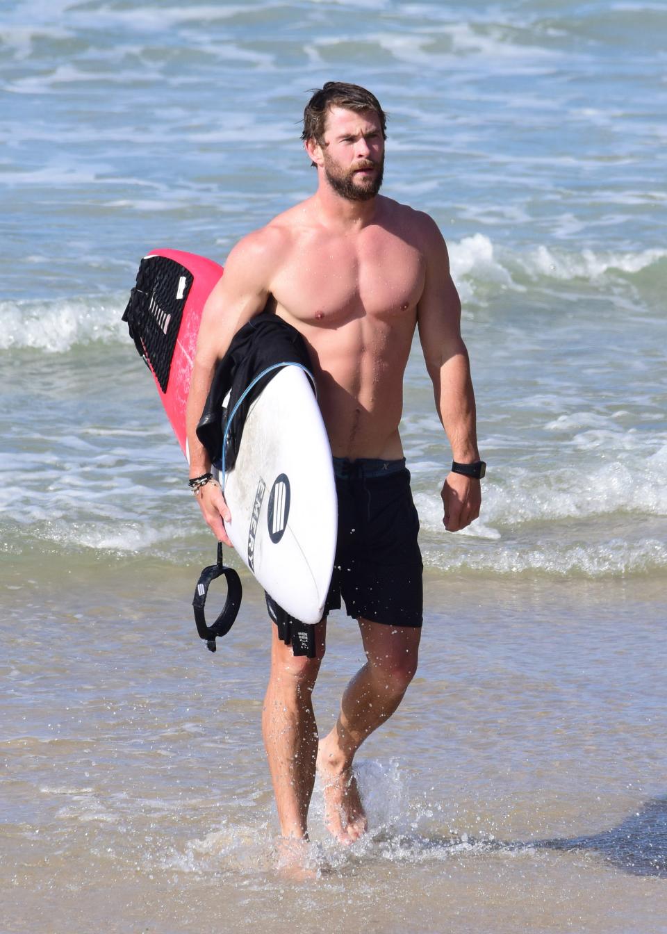 Chris Hemsworth surfing in Byron Bay, Australia.