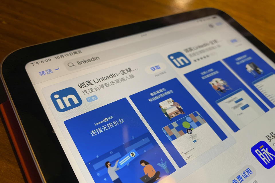 The internet App Store page showing the Chinese LinkedIn app is displayed on a device in Beijing, China, Friday, Oct. 15, 2021. Microsoft is shutting down its main LinkedIn service in China later this year as Beijing tightens its internet rules. (AP Photo/Ng Han Guan)