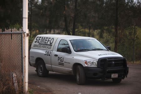 A forensics truck leaves a ranch where a gunfight between hitmen and federal forces left several casualties in Tanhuato, state of Michoacan, May 22, 2015. REUTERS/Alan Ortega