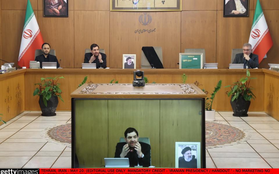 First Vice President Mohammad Mokhber (2nd L) chairs the emergency meeting, held by government council, following the death of Iranian President Ebrahim Raisi and other senior government officials in a helicopter crash in Tehran,