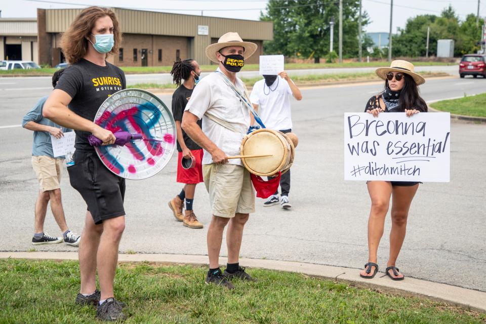 Protesters beat drums and chant outside the Dare to Care facility on Fern Valley Road during a visit by Sen. Mitch McConnell. July 6, 2020