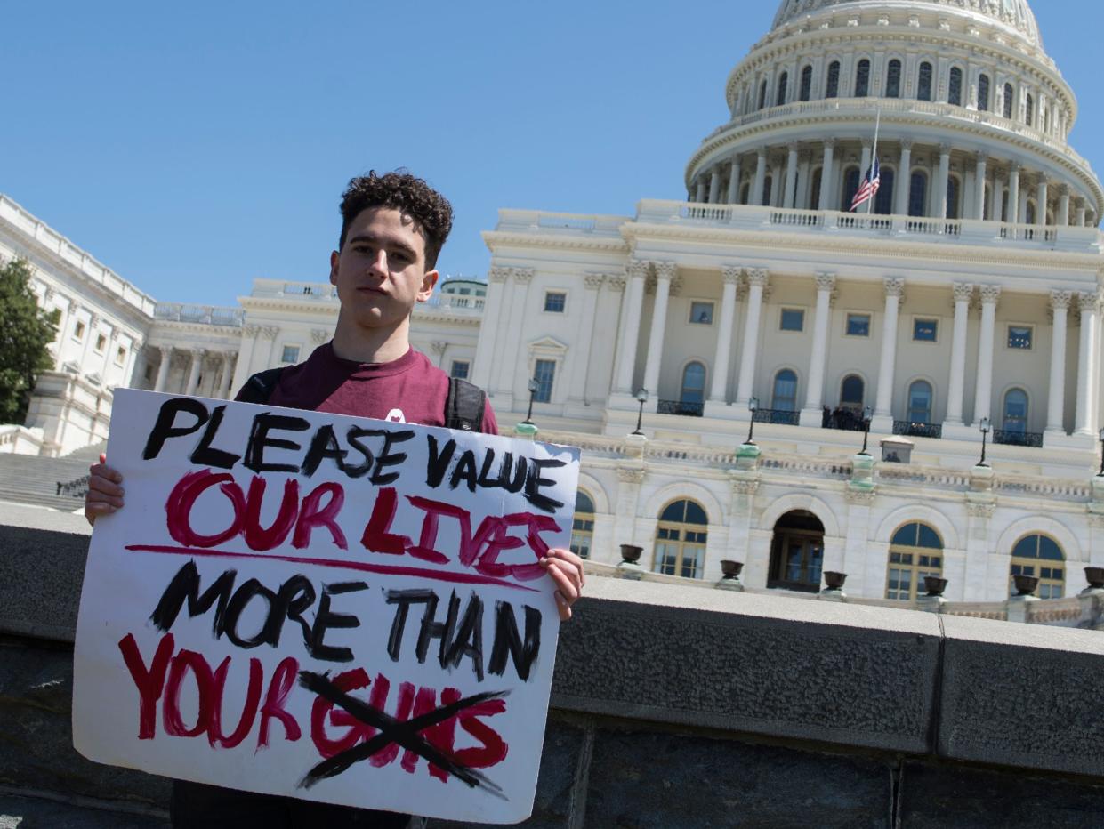 <p>A student of Marjory Stoneman Douglas High School campaigning for new gun safety laws</p> (AFP via Getty Images)