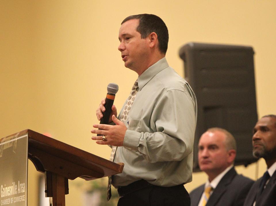 Matt Surrency, former Hawthorne mayor and president of the Florida League of Cities, speaks at a Gainesville Area Chamber of Commerce event.