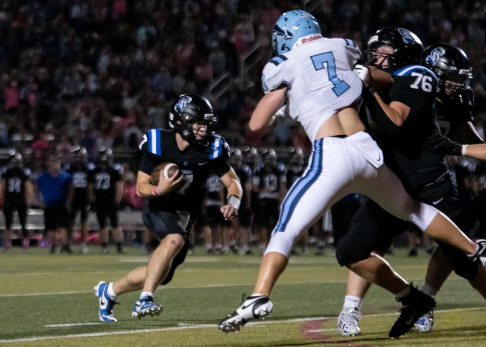 Central Bucks South quarterback Owen Pinkerton runs down the middle in a football game against North Penn, on Friday, October 4, 2024, at Central Bucks South in Warrington.