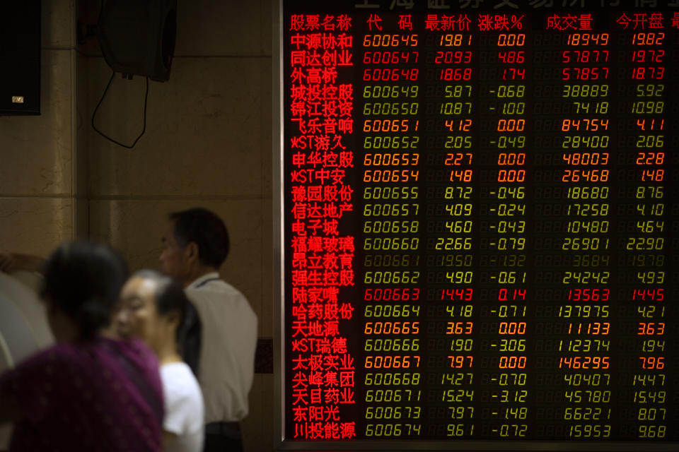 Chinese investors use computer terminals as they monitor stock prices at a brokerage house in Beijing, Wednesday, Sept. 11, 2019. Asian shares were mostly higher Wednesday, cheered by a rise on Wall Street amid some signs of easing tensions between the U.S. and China on trade issues. (AP Photo/Mark Schiefelbein)