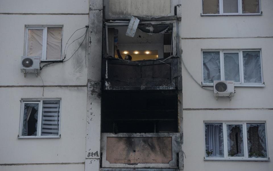 Elena Fedianinova checks her apartment damaged in a reported drone attack in Voronezh