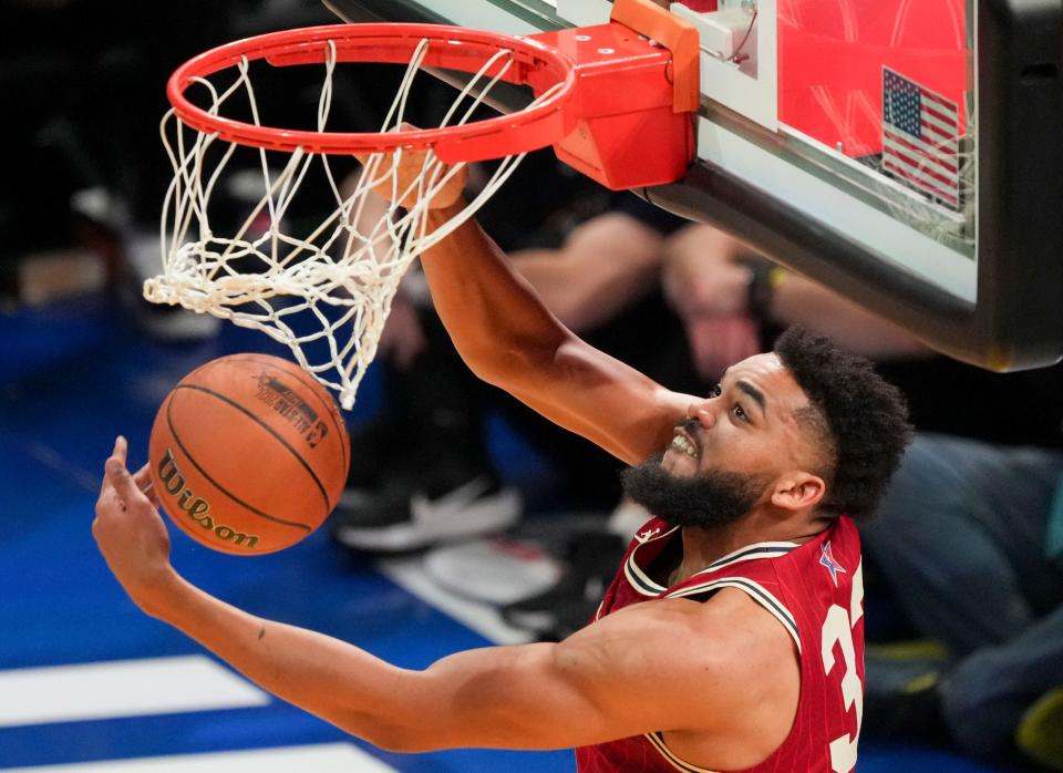 Western Conference center Karl-Anthony Towns (32) of the Minnesota Timberwolves dunks the ball Sunday, Feb. 18, 2024, during the 73rd NBA All-Star game at Gainbridge Fieldhouse in downtown Indianapolis.