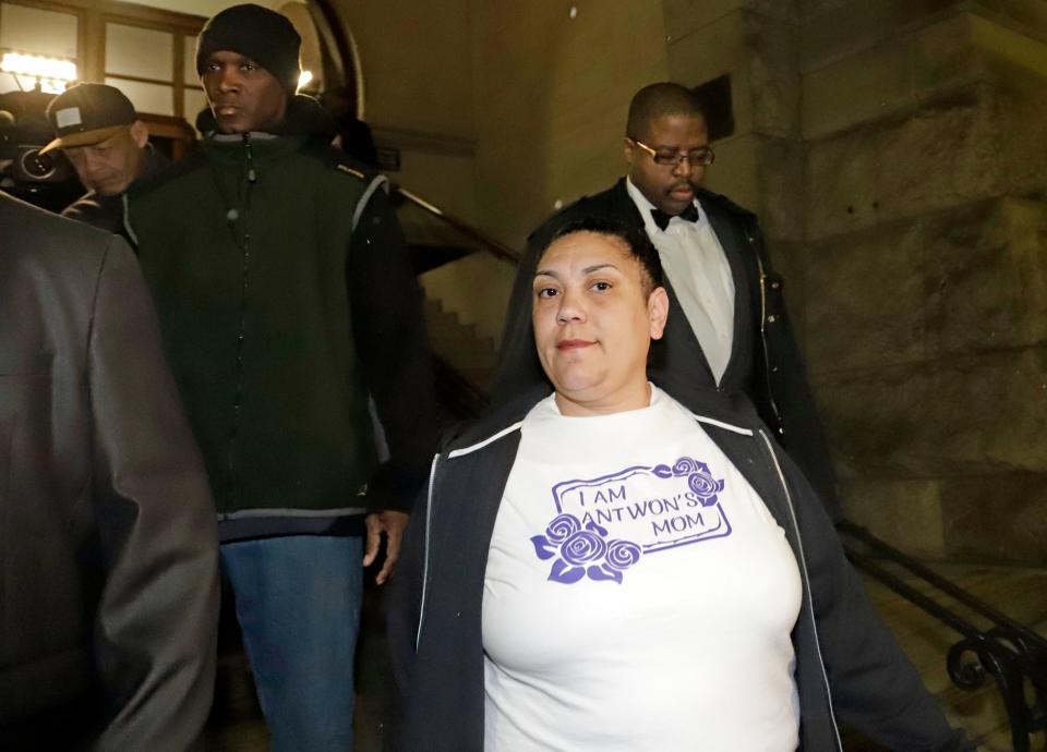 Michelle Kenney, center, the mother of Antwon Rose II, leaves the Allegheny County Courthouse with supporters after hearing the verdict of not guilty on all charges for Michael Rosfeld, a former police officer in East Pittsburgh, Pa., Friday, March 22, 2019.