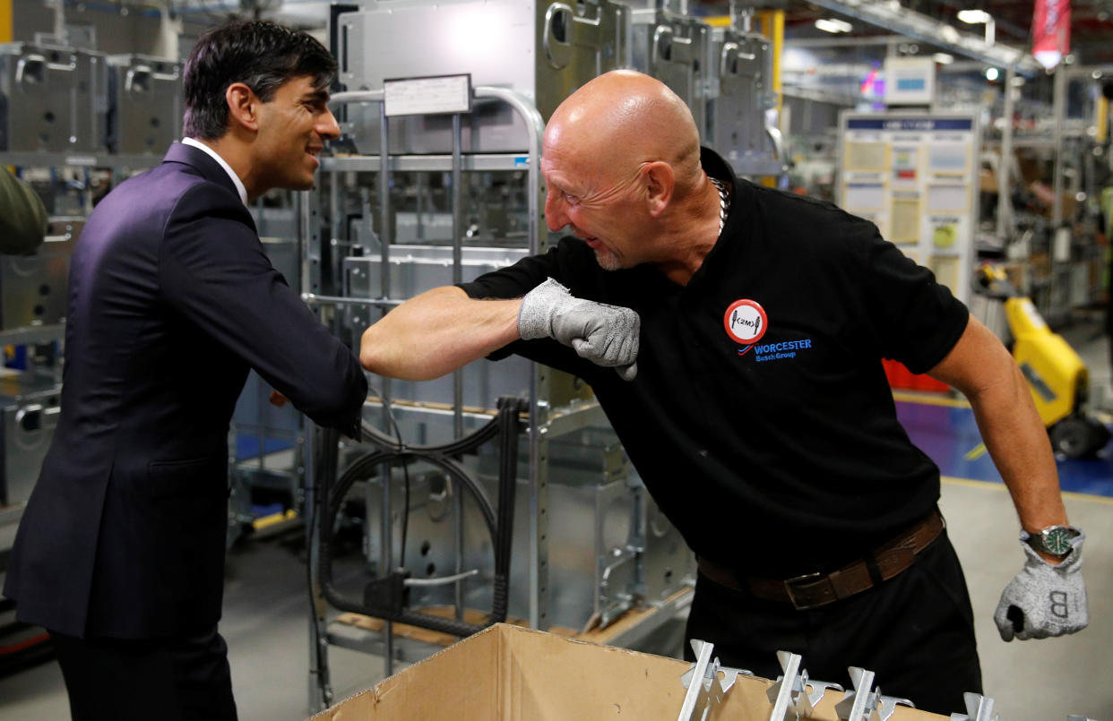 Chancellor of the exchequer Rishi Sunak greets an employee during a visit to the Worcester Bosch factory in Worcester, Britain. Photo: Phil Noble/Reuters