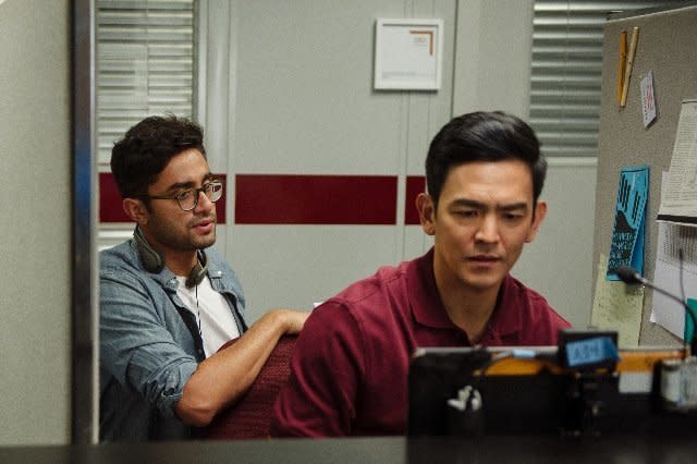 Director Aneesh Chaganty (left), with actor John Cho (right), on the set of "Searching." (Photo: Screen Gems)