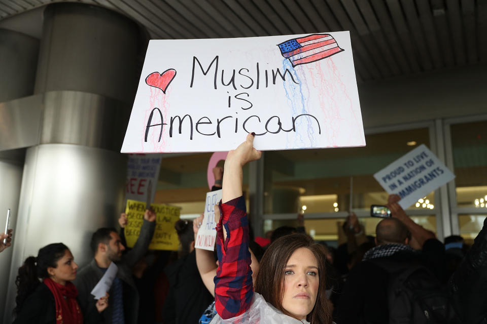 Tristan Houghton joins with other protesters as they stand together at the Miami International Airport against the executive order that President Donald Trump signed clamping down on refugee admissions and temporarily restricting travelers from seven predominantly Muslim countries on January 29, 2017 in Miami, Florida.&nbsp;