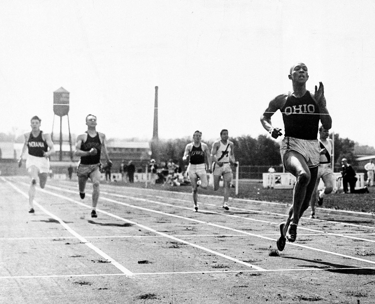 Jesse Owens of Ohio State University crosses the finish line in the 220-yard dash with a record speed of 20.3 seconds at the Big Ten Western Conference Track and Field meet at the University of Michigan in Ann Arbor, Mich., May 25, 1935. Owens, nicknamed the "Buckeye Bullet," broke three world records, including the 220-yard hurdle, 22.6; and the long jump, 26 feet, 1/4 inches. He tied the 100-yard dash record, 9.4 seconds.