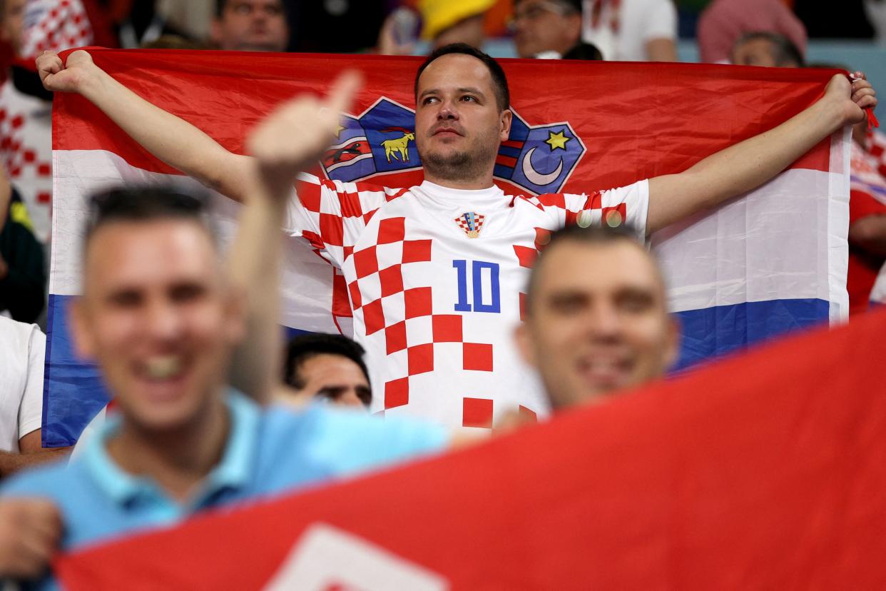 A fan of Croatia celebrates after the team defeated Canada 4-1 in the Qatar 2022 World Cup Group F football match between Croatia and Canada at the Khalifa International Stadium in Doha on November 27, 2022. (Photo by ADRIAN DENNIS / AFP) (Photo by ADRIAN DENNIS/AFP via Getty Images)