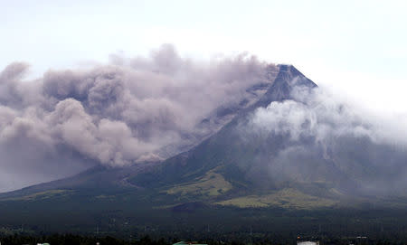 The Mayon volcano spews a column of ash during another mild eruption in Legazpi City, Albay province, south of Manila, Philippines January 16, 2018. REUTERS/Stringer