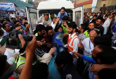 An injured man is rushed to a hospital after he was injured during clashes between police and protesters, in Srinagar, August 5, 2016. REUTERS/Danish Ismail