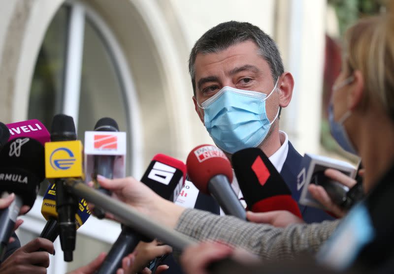 Georgia's Prime Minister Gakharia visits a polling station during a parliamentary election in Tbilisi