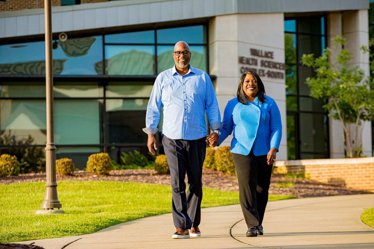 Dr. Orinthia Montague and her husband Mr. Michael McGhee walk along Volunteer State Community College's campus.