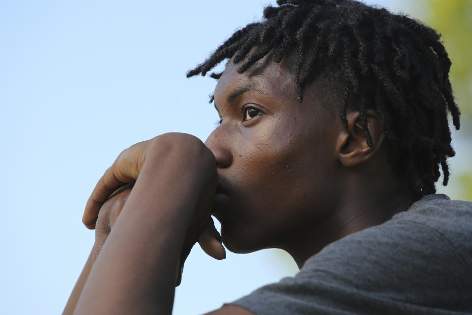 Jamari Shaw, 16, poses for a portrait in his East side neighborhood Thursday, May 11, 2023, in Buffalo, N.Y. Shaw is one of many young people who are still nervous in their surroundings since last years racist mass shooting at Tops Market. (AP Photo/Jeffrey T. Barnes)