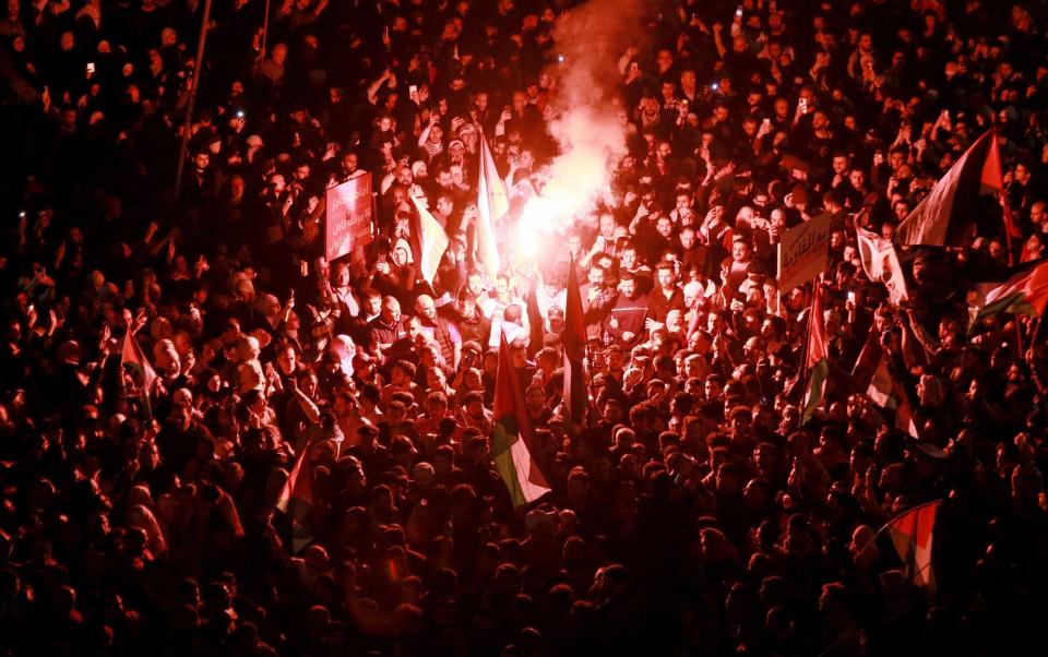 Jordanians chant slogans during a demonstration near the Israeli embassy in Amman on March 28, 2024