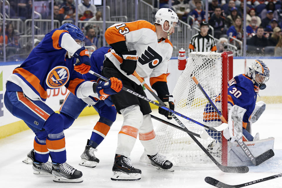 New York Islanders goaltender Ilya Sorokin makes a save on a shot by Philadelphia Flyers center Kevin Hayes (13) in the first period of an NHL hockey game Saturday, April 8, 2023, in Elmont, N.Y. (AP Photo/Adam Hunger)