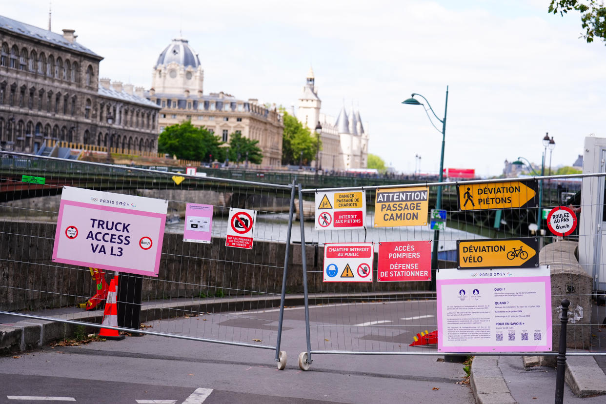 Perimeter fencing with directional signage near the River Seine, Paris. The Opening Ceremony of the Paris 2024 Olympic Games takes place on Friday 26th July, along the River Seine. Picture date: Monday July 22, 2024. (Photo by Mike Egerton/PA Images via Getty Images)