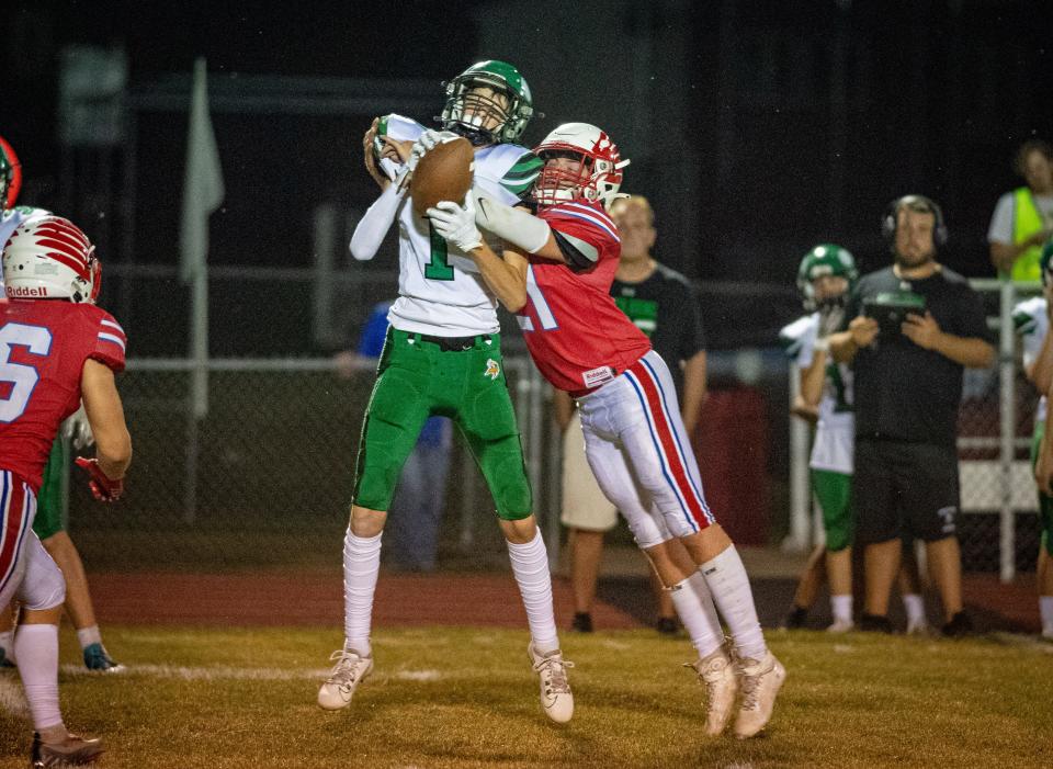 Oregon's Dalton McCammon tries to break up a pass to North Boone's Brandon Slater in the fourth quarter of their game in Oregon on Friday, Aug. 25, 2023.