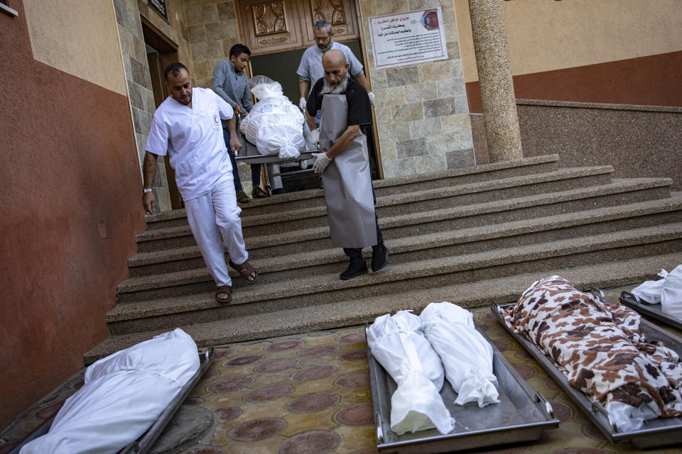 Palestinians mourn their relatives killed in the Israeli bombardment of the Gaza Strip, in the hospital in Khan Younis, Saturday, Dec. 2, 2023. (AP Photo/Fatima Shbair)