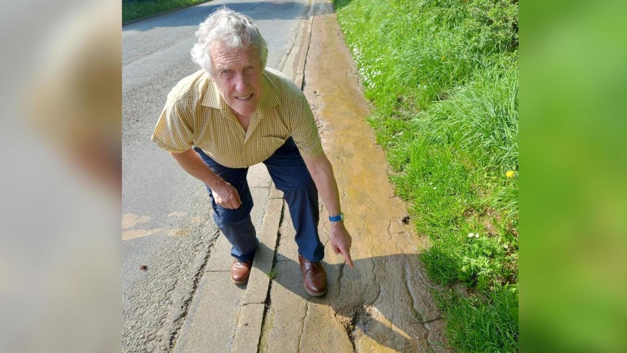 Councillor Steve Kay inspects the pedestrian footpath between Lingdale and Boosbeck, in East Cleveland