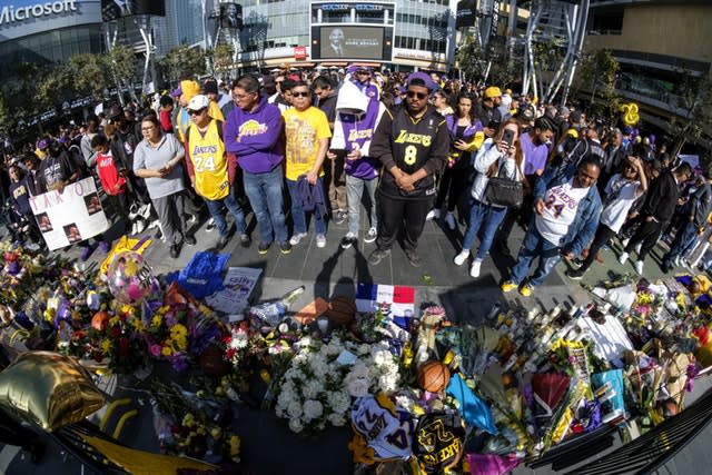 People gather at a memorial for Kobe Bryant near Staples Center 