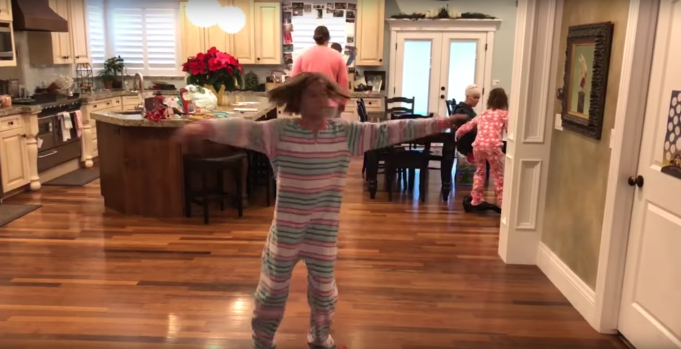 She decided to spin for the camera while on a hoverboard. Photo: YouTube/Kids Getting Hurt