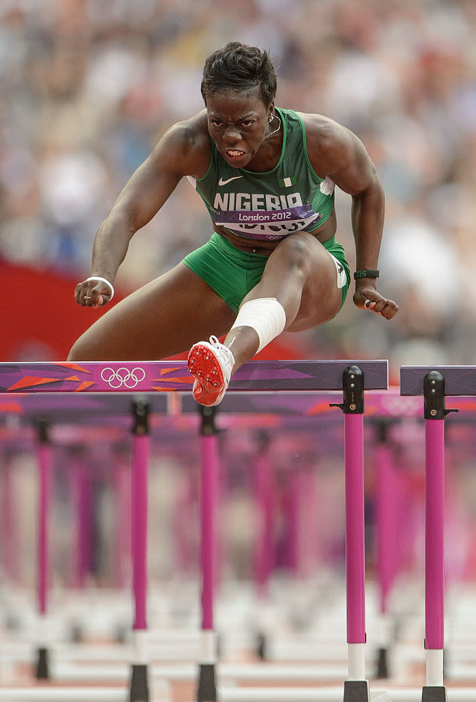 Adigun jumping the hurdles